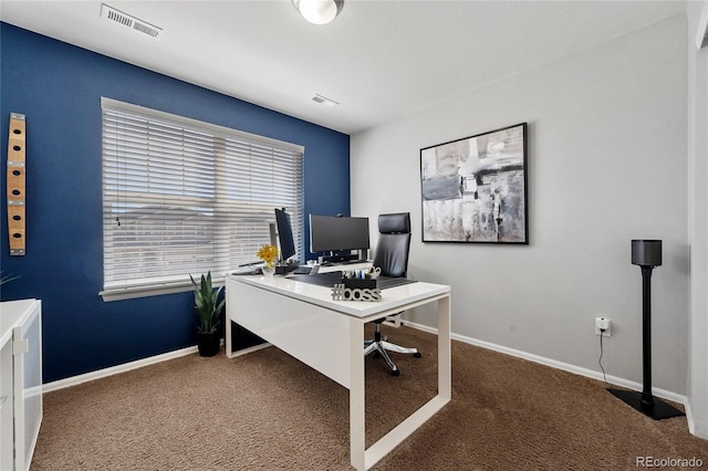 carpeted home office featuring baseboards and visible vents