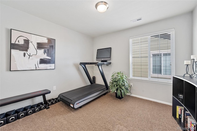 exercise room featuring baseboards, carpet, and visible vents