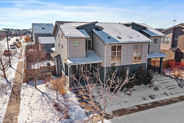 view of property exterior with a residential view