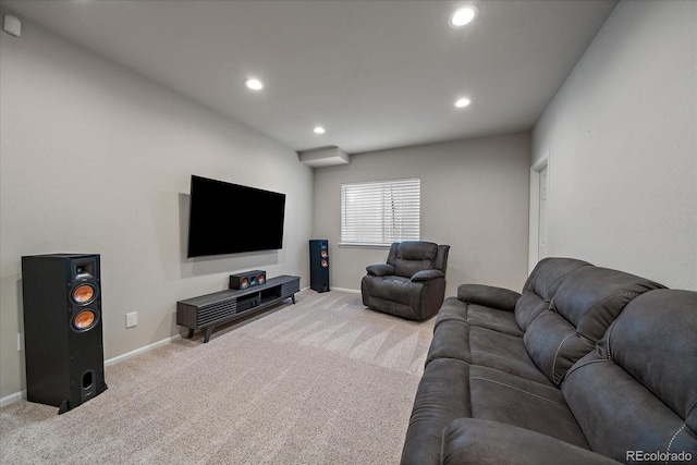 living area with recessed lighting, baseboards, and light colored carpet