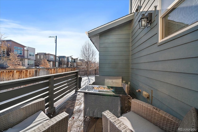 exterior space featuring a residential view and a fire pit