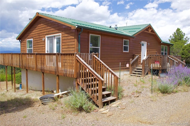 rear view of property with a deck