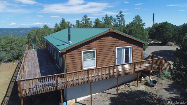 view of side of home featuring a deck