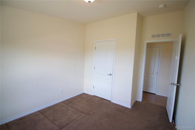 unfurnished bedroom with carpet floors