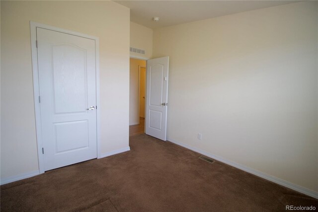 unfurnished bedroom featuring carpet