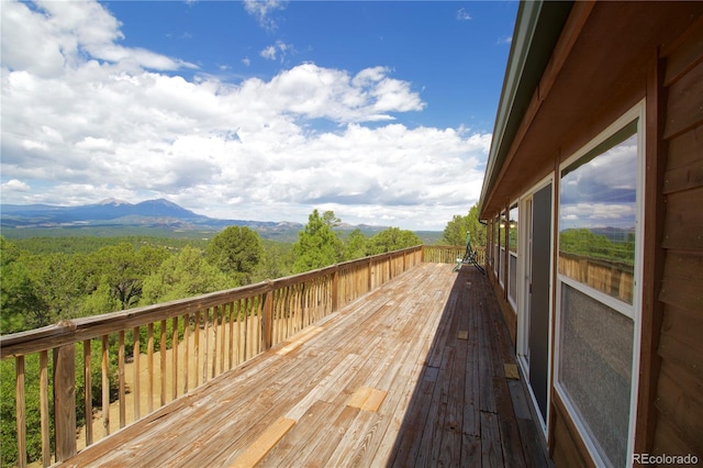 wooden deck featuring a mountain view