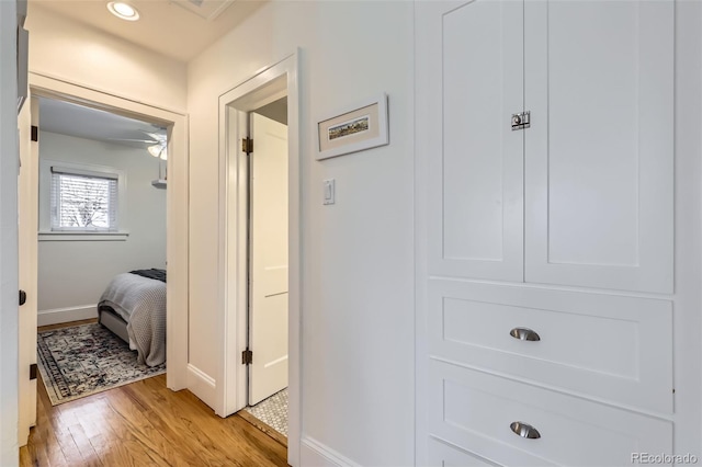 hallway with light wood-type flooring