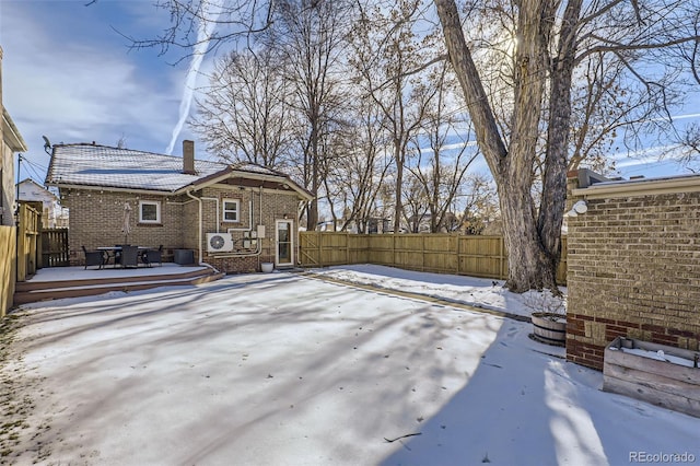 yard layered in snow with a wooden deck