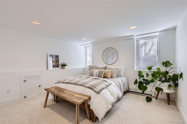 bedroom featuring recessed lighting, multiple windows, and light carpet