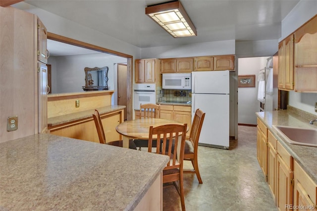 4960 S Fox St, Englewood, CO 80110 - kitchen featuring white appliances, a sink, light countertops, backsplash, and light brown cabinetry