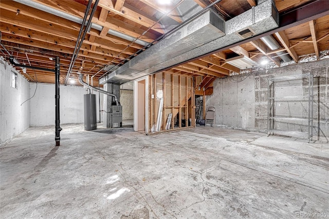 basement featuring heating unit and water heater