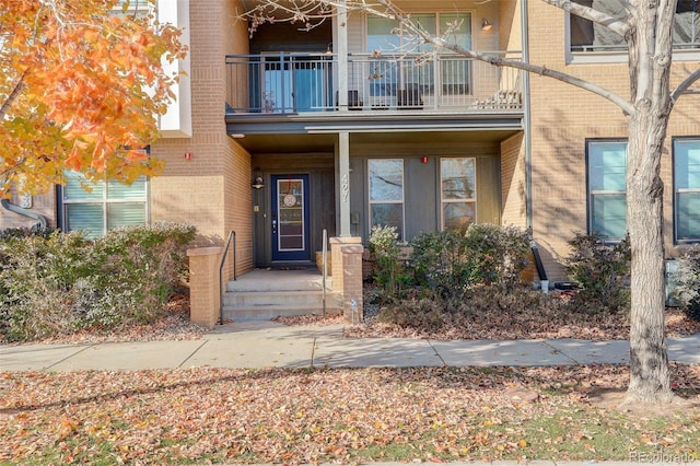 entrance to property with a balcony