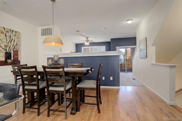 dining room featuring ceiling fan and light wood-type flooring