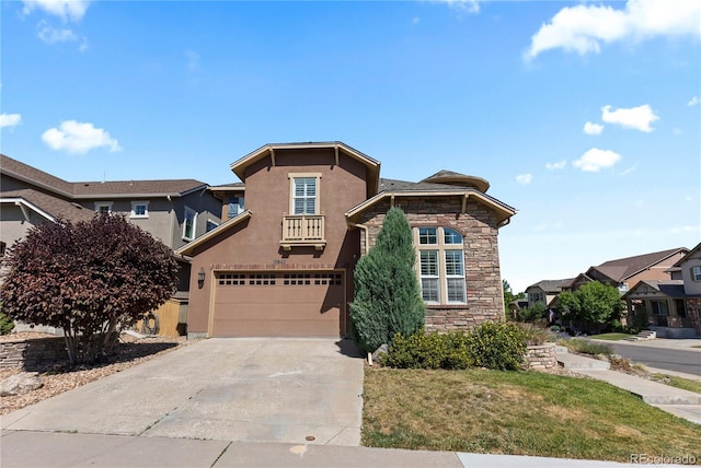 10840 Valleybrook Cir, Highlands Ranch, CO 80130 - view of front facade with stone siding, driveway, a garage, a residential view, and stucco siding