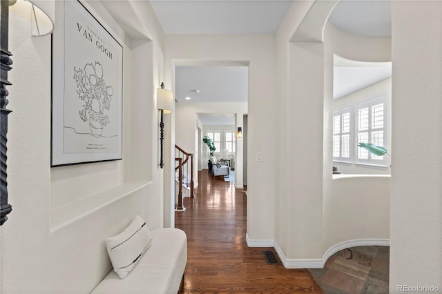 10840 Valleybrook Cir, Highlands Ranch, CO 80130 - corridor featuring plenty of natural light, stairs, and dark wood-type flooring