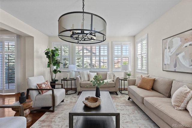 10840 Valleybrook Cir, Highlands Ranch, CO 80130 - living area featuring healthy amount of natural light, wood finished floors, and a chandelier