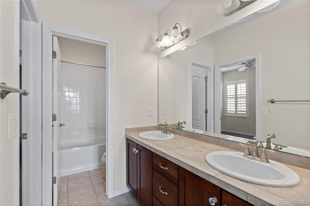 10840 Valleybrook Cir, Highlands Ranch, CO 80130 - full bathroom with double vanity, tile patterned floors, and shower / bath combination