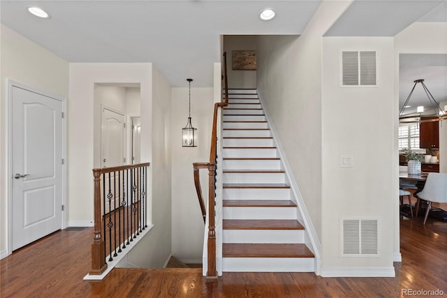 10840 Valleybrook Cir, Highlands Ranch, CO 80130 - staircase featuring wood finished floors and recessed lighting