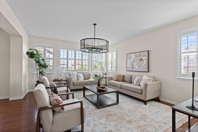 10840 Valleybrook Cir, Highlands Ranch, CO 80130 - living area featuring healthy amount of natural light, wood finished floors, and a chandelier