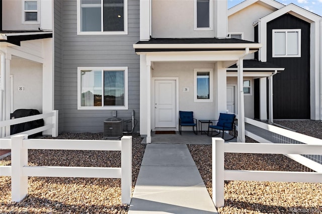 doorway to property featuring central AC unit