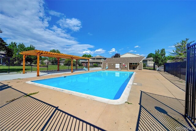 community pool featuring a patio area, fence, and a pergola