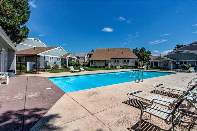 view of swimming pool with a patio