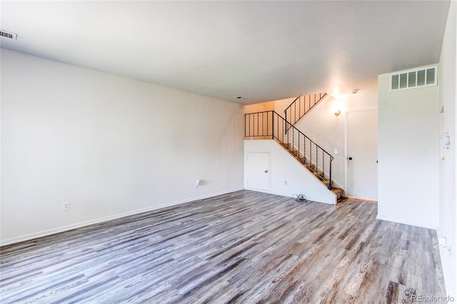 unfurnished living room featuring light wood-type flooring