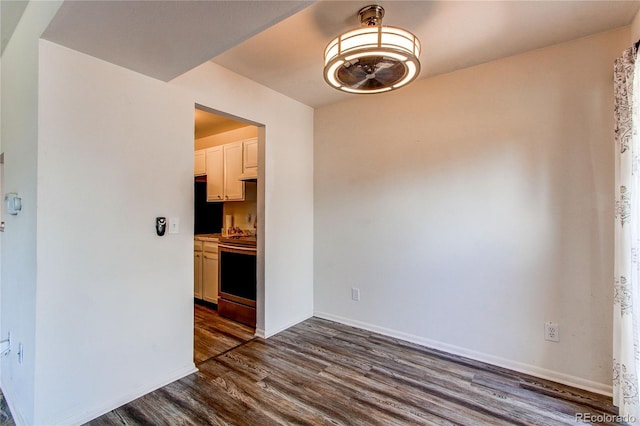 unfurnished dining area featuring dark hardwood / wood-style floors