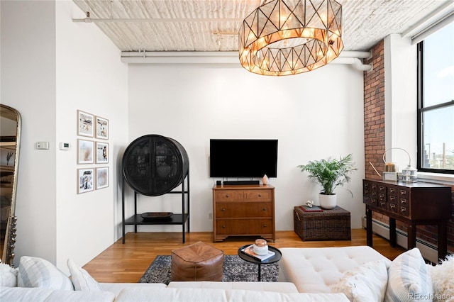 2261 Blake St Unit 2G, Denver, CO 80205 - living area featuring wood finished floors and a chandelier