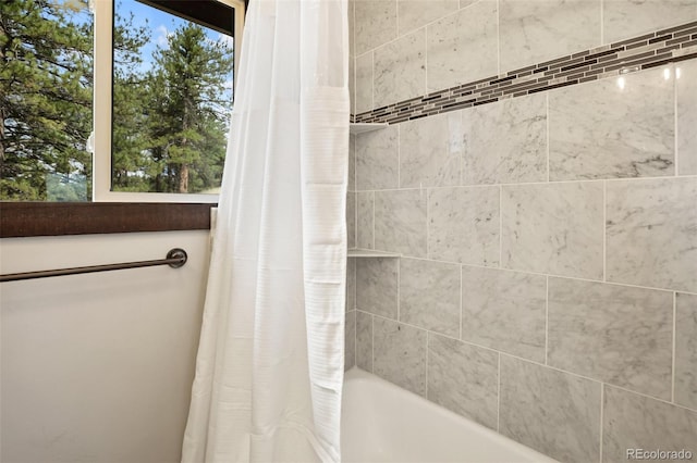full bath with shower / bathtub combination with curtain