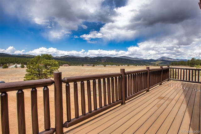 wooden deck featuring a mountain view