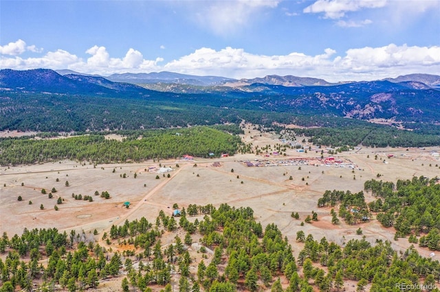 birds eye view of property with a mountain view and a rural view