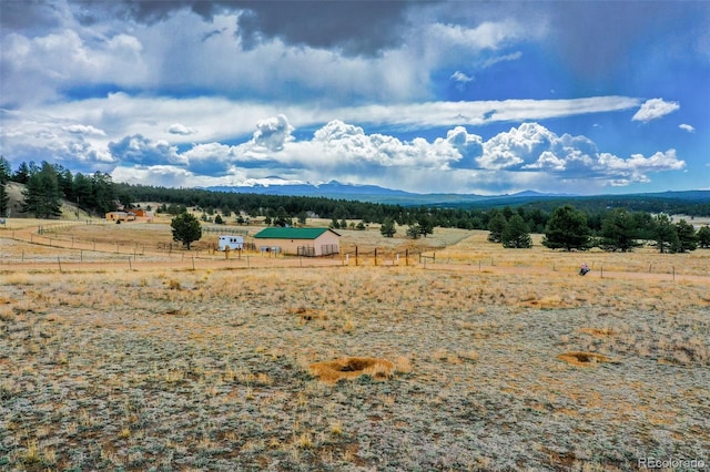 view of mountain feature with a rural view