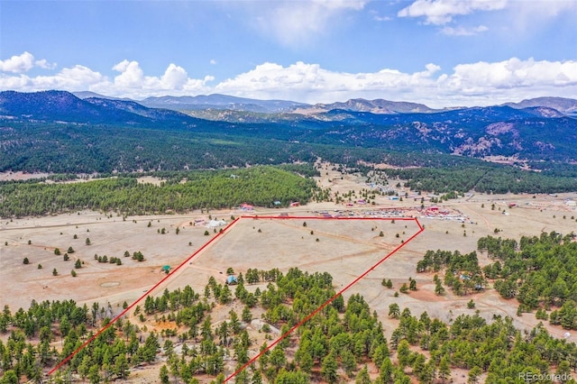 bird's eye view featuring a rural view and a mountain view