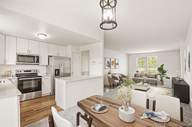 dining area with light wood-style flooring