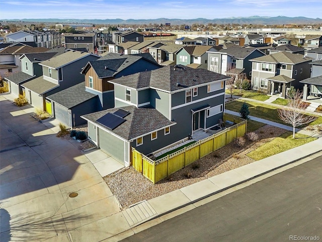 drone / aerial view featuring a mountain view and a residential view