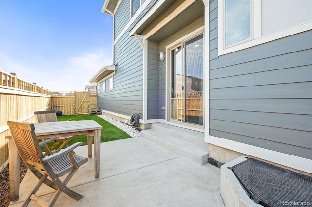 view of patio / terrace with entry steps and fence