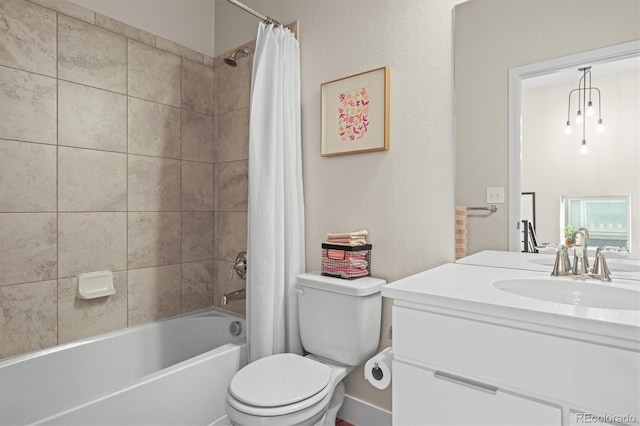 bathroom featuring vanity, toilet, and shower / bath combo with shower curtain