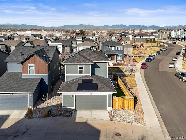 drone / aerial view featuring a mountain view and a residential view