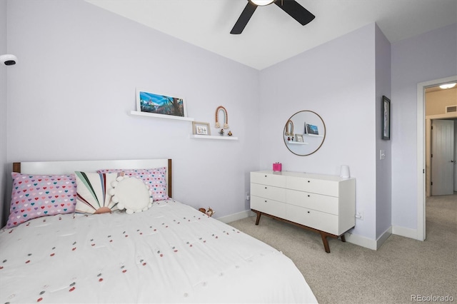 carpeted bedroom featuring visible vents, baseboards, and ceiling fan