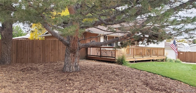 view of yard featuring a wooden deck