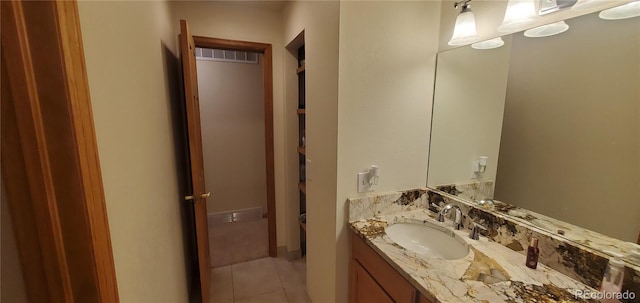 bathroom with vanity and tile patterned flooring