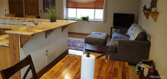 living room featuring sink