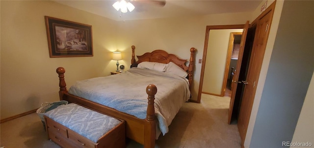 bedroom featuring ceiling fan and light carpet