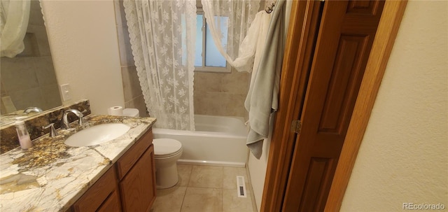 full bathroom featuring vanity, shower / bath combination with curtain, toilet, and tile patterned flooring