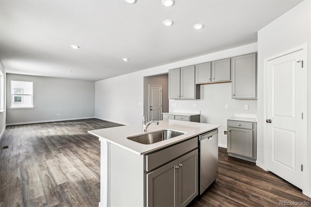 14420 Ranch St, Mead, CO 80504 - kitchen with gray cabinets, dark wood finished floors, a center island with sink, dishwasher, and recessed lighting