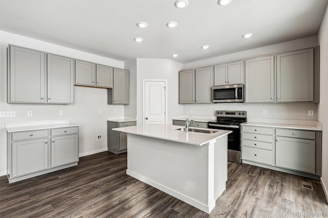 14420 Ranch St, Mead, CO 80504 - kitchen featuring gray cabinets, stainless steel appliances, dark wood-style floors, light countertops, and recessed lighting
