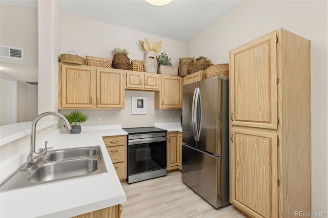 1158 Opal St Unit 203, Broomfield, CO 80020 - kitchen with appliances with stainless steel finishes, light brown cabinets, and light countertops
