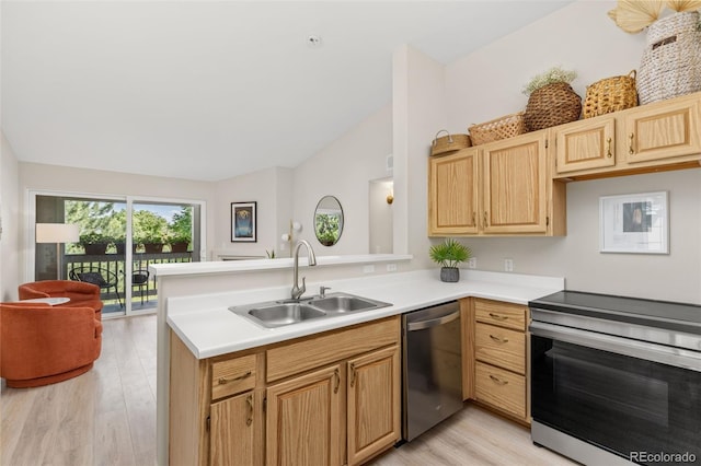 1158 Opal St Unit 203, Broomfield, CO 80020 - kitchen with stainless steel appliances, a peninsula, light wood-style flooring, vaulted ceiling, and light countertops