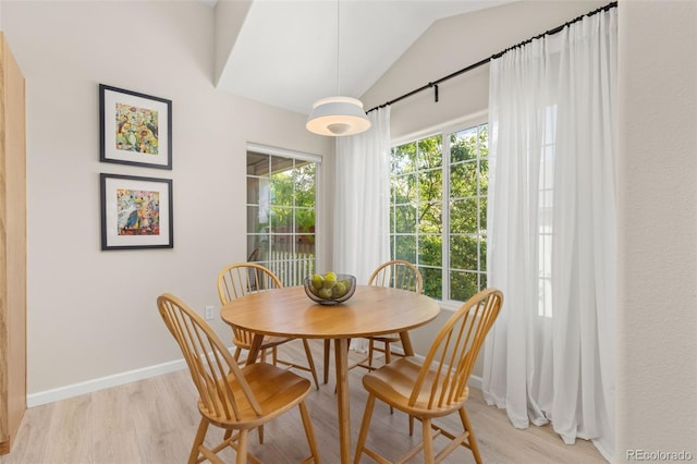 1158 Opal St Unit 203, Broomfield, CO 80020 - dining area featuring vaulted ceiling and light wood-style flooring